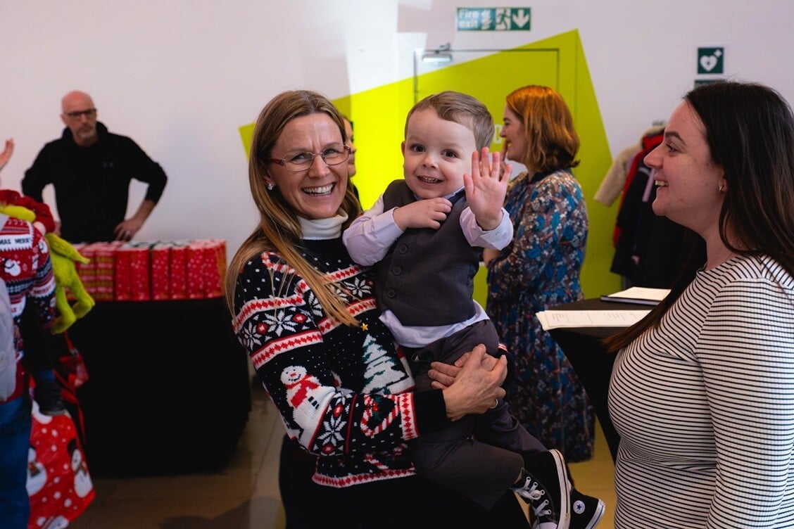 Picture of Dawn Forbes and a family at the Worcestershire Acute Hospitals Charity Christmas Party