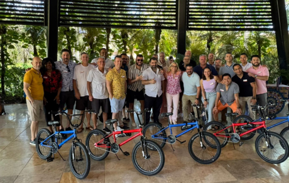 Group shot of the completed Build-a-Bike CSR activity as part of the Avaya Costa Rica incentive trip.