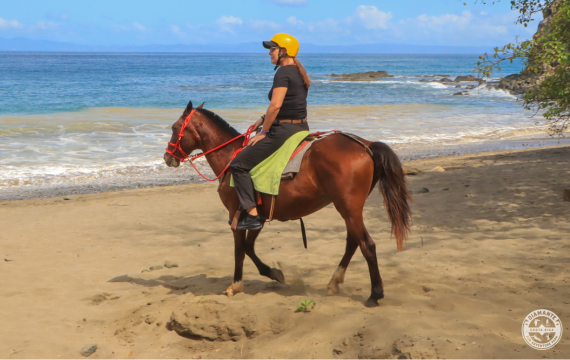 Shot of a woman horse riding as part of the Avaya Costa Rica Incentive trip.