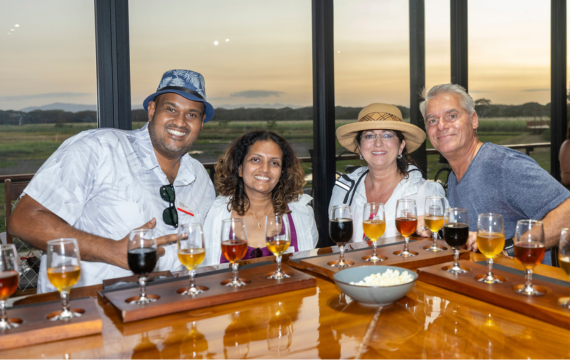 Group shot of four people at a bar as part of the Avaya Costa Rica incentive trip.