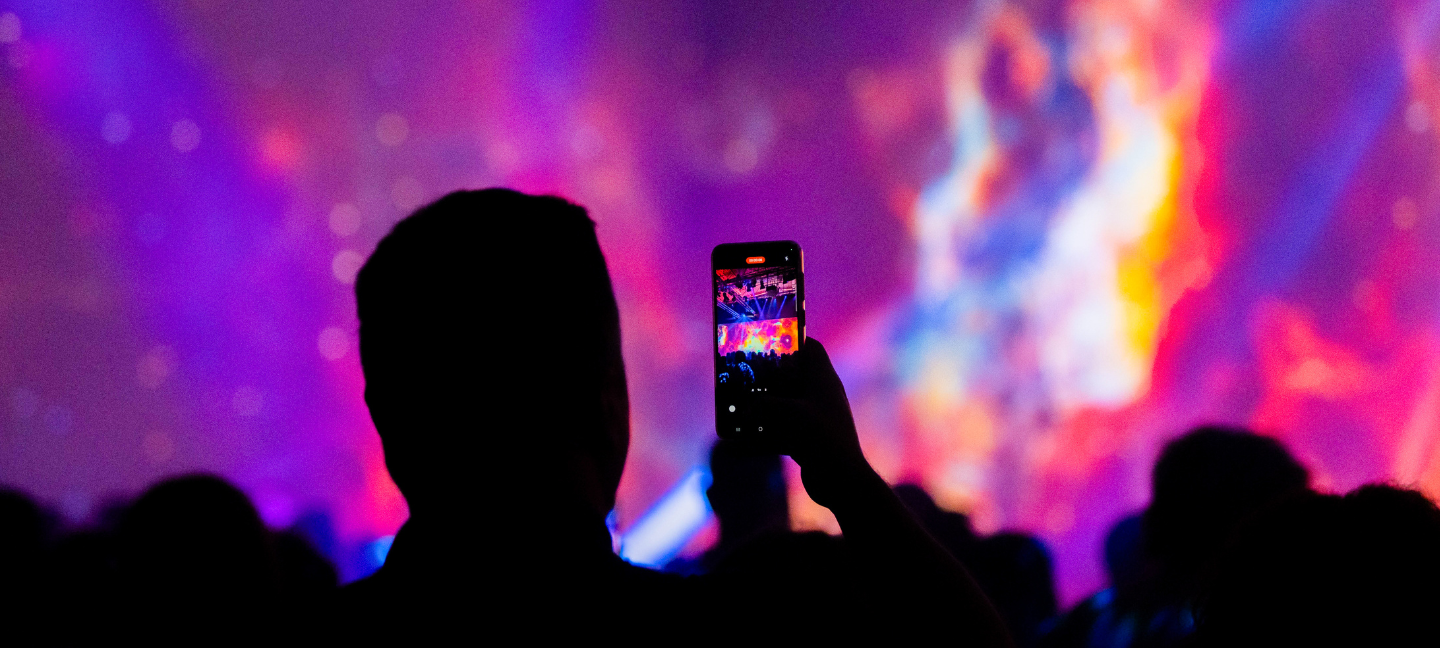 Picture of someone taking a photo of the 4D immersive film at the PPC Commercial Conference Athens.