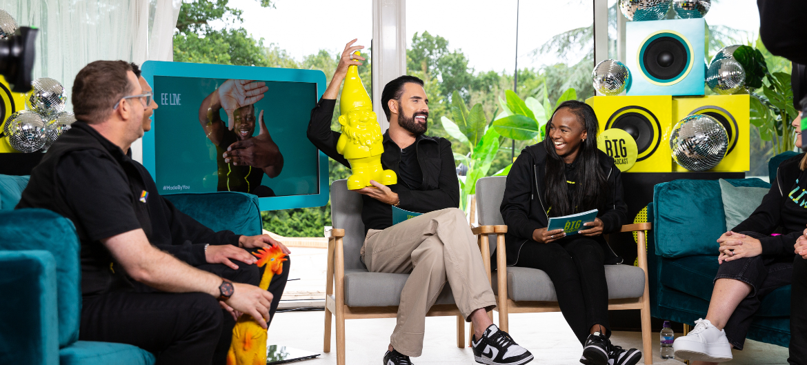 Shot of Rylan Clark holding a yellow gnome as part of EE Live The Big Broadcast