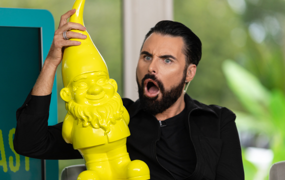 Shot of Rylan holding a yellow gnome as part of EE Live The Big Broadcast