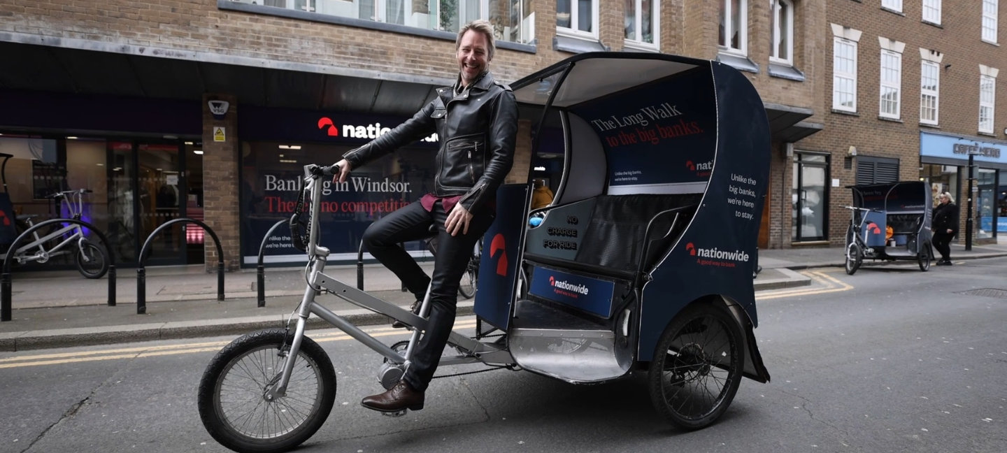 Chesney Hawkes on a rickshaw outside a Nationwide branch for the Nationwide Last Branch In Town campaign event