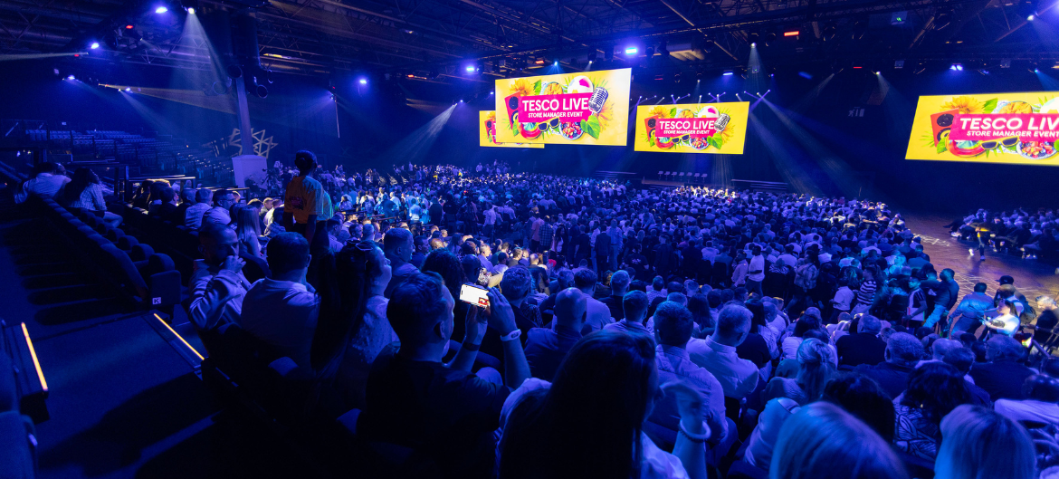 Wide shot of Tesco Live with an audience of store managers