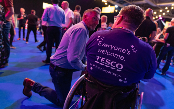 Shot of a man in a wheelchair at Tesco Live with a tshirt that says 'Everyone's welcome.'