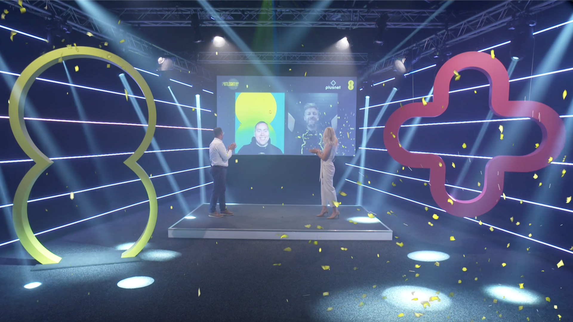 Picture of male and female hosts cheering someone winning at the hybrid EE Spotlight Awards.